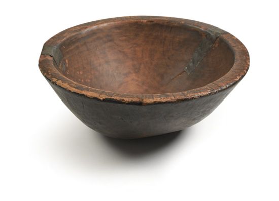 (SLAVERY AND ABOLITION--SLAVE CULTURE.) Antique American burl bowl, incised with African designs along the lip.
